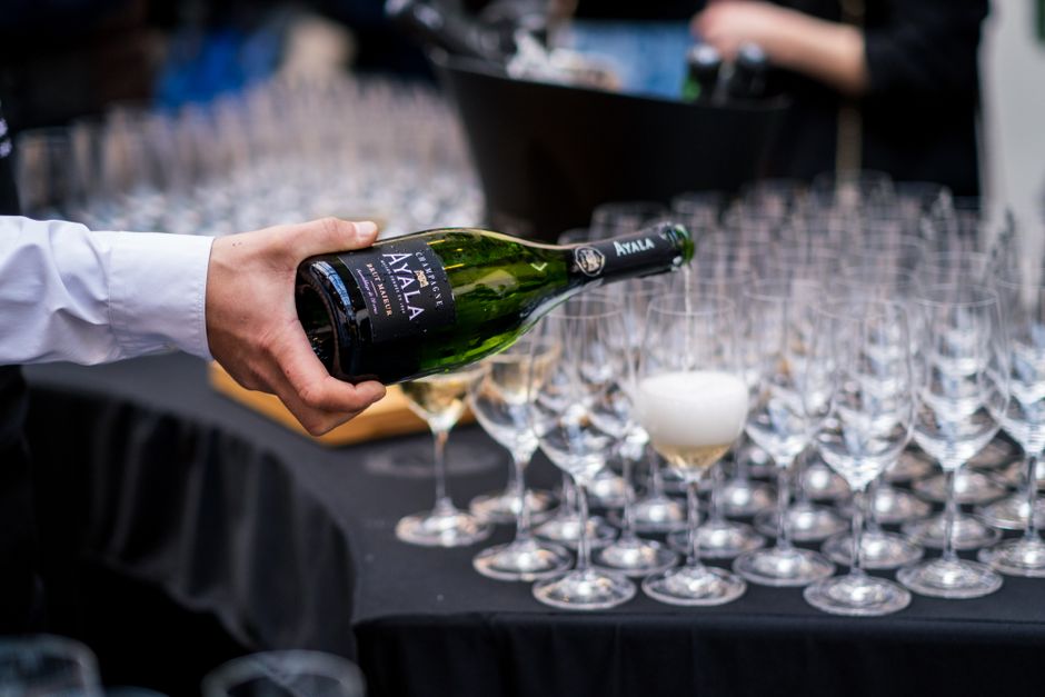 Bartender pouring champagne for corporate catering